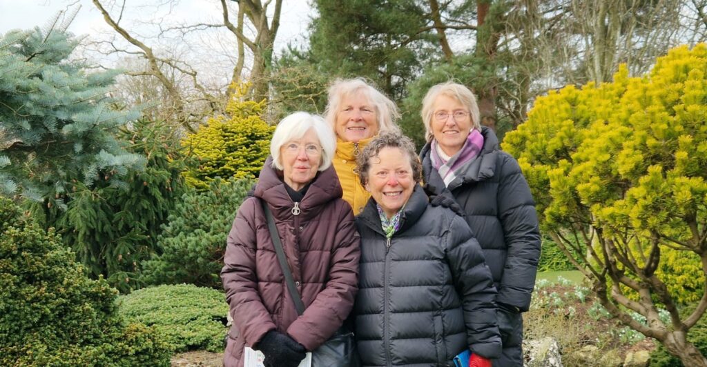 4 women in a garden